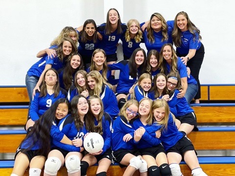 A group of female middle school volleyball players